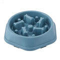 Blue plastic slow feeder bowl with raised bone-shaped ridges