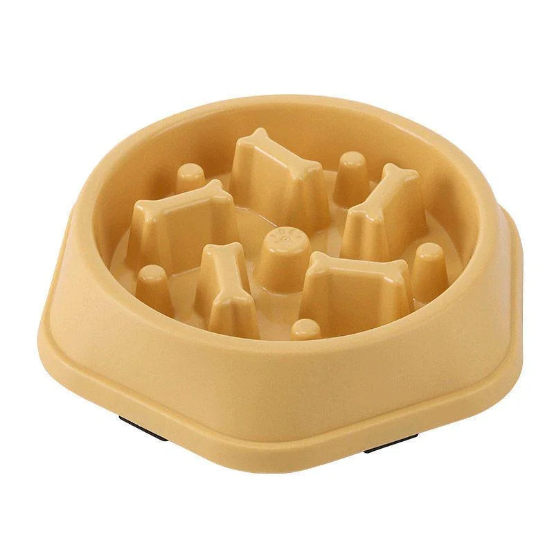 Yellow plastic slow feeder dog bowl with raised bone-shaped ridges